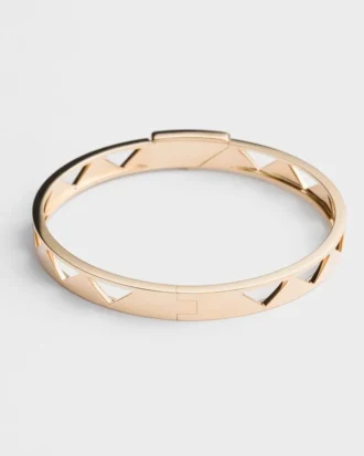 Bransoletka typu bangle z wycięciami z żółtego złota Bransoletka typu bangle z wycięciami z żółtego złota