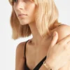 Bransoletka typu bangle z wycięciami z żółtego złota Bransoletka typu bangle z wycięciami z żółtego złota