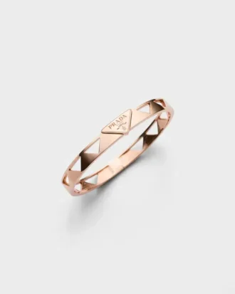 Bransoletka typu bangle z wycięciem z wiecznego złota w kolorze różowym Bransoletka typu bangle z wycięciem z wiecznego złota w kolorze różowym