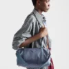 Duża torba podróżna z tkaniny Re-Nylon i skóry Saffiano Duża torba podróżna z tkaniny Re-Nylon i skóry Saffiano