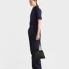 Średniej wielkości skórzana torba Prada Passage z klapką z materiału Re-Nylon Średniej wielkości skórzana torba Prada Passage z klapką z materiału Re-Nylon