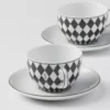 Zestaw dwóch porcelanowych filiżanek do herbaty – szachownica Zestaw dwóch porcelanowych filiżanek do herbaty – szachownica